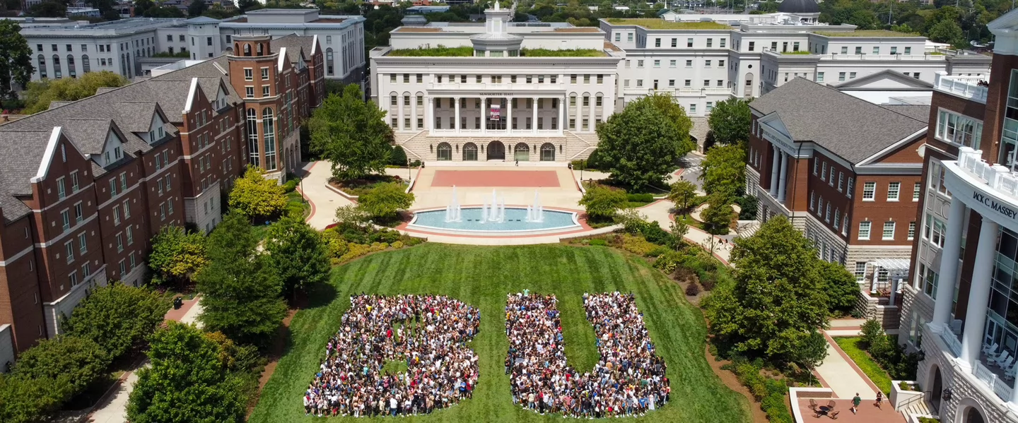 First Year students spelling out BU on the South Lawn on a sunny day