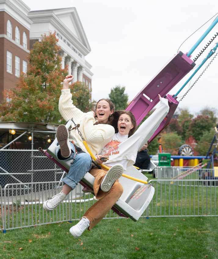 Students on a carnival ride during Day to Dream
