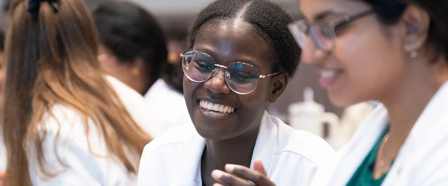 Medical student talking with a patient with a smile