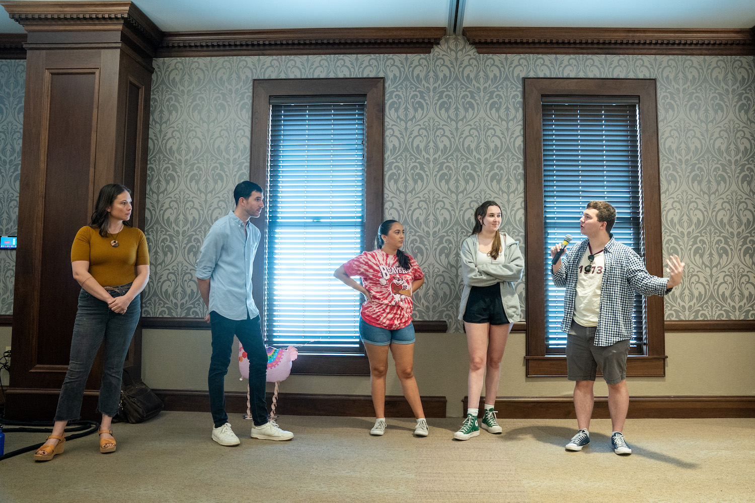 Alumna Emma Supica and improv comic Adam Watson lead three Belmont students in an improv storytelling exercise. 